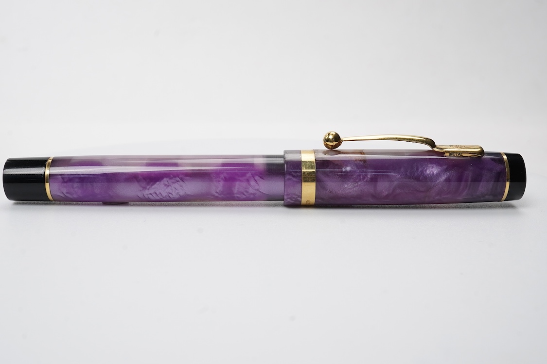 A modern Conway Stewart 'Duro' in stunning purple fitted with 18ct. gold medium nib
